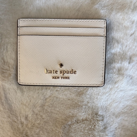 kate spade Handbags - Kate Spade Ivory Card Holder with Gold Accents